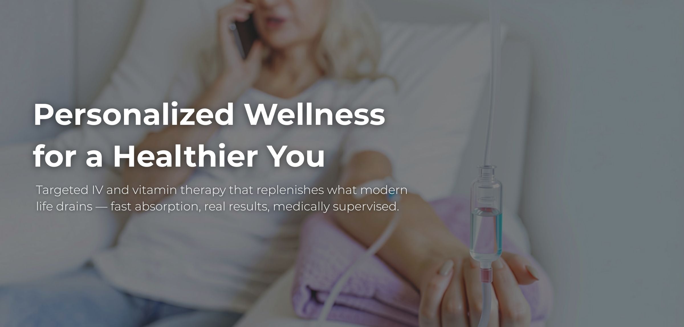 Promotional graphic for personalized wellness IV therapy, showing a woman in bed with a phone and an IV bag in the foreground, with overlaid text reading 'Personalized Wellness for a Healthier You'.